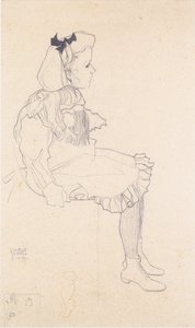 Fille assise avec un nœud dans les cheveux